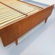 Double bed vintage Scandinavian in teak from the 1960s with integrated bedside tables.