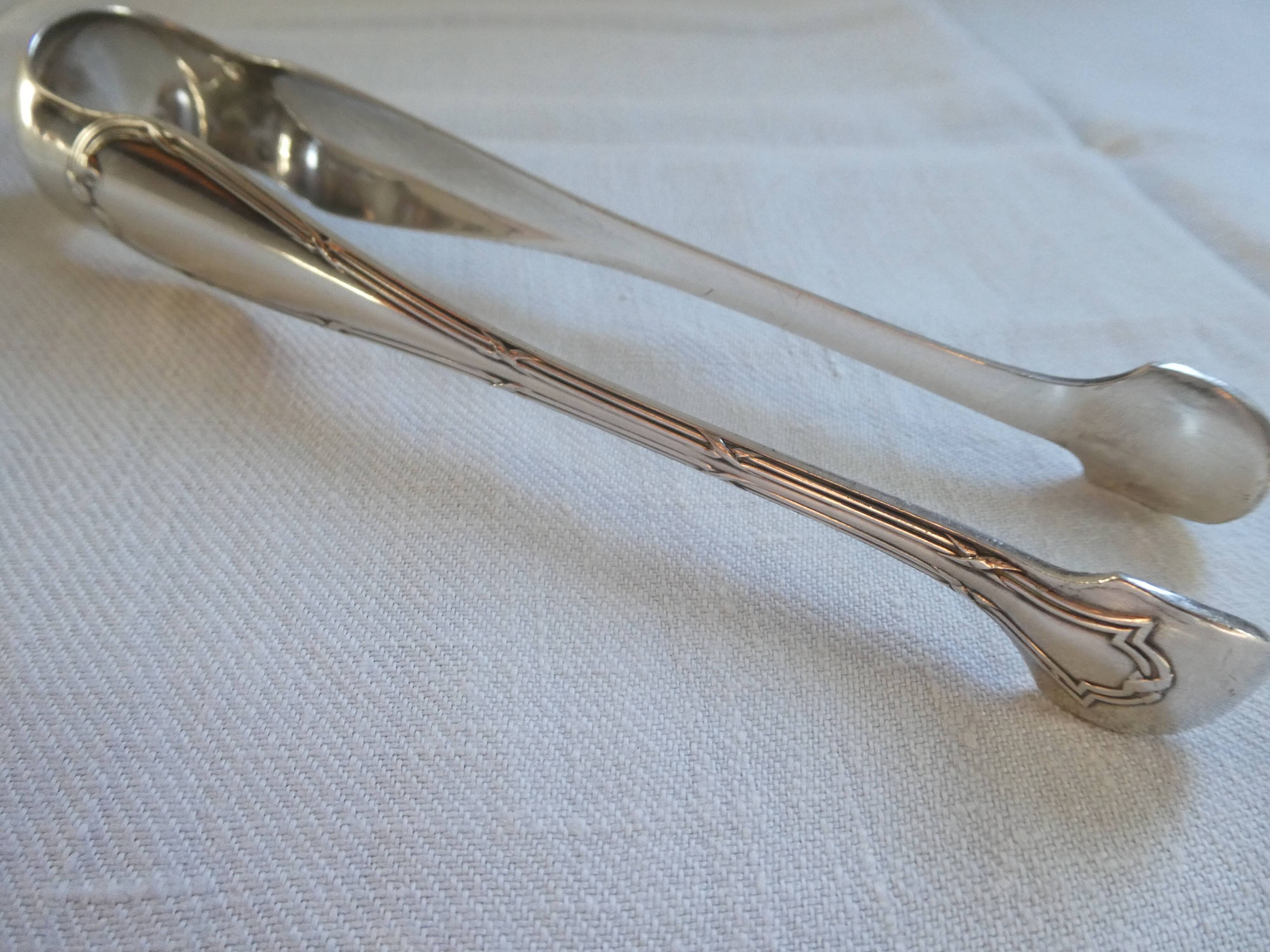 Christofle Silver-plated metal sugar tongs with crossed ribbon bow design