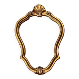 Old small wall mirror in golden resin