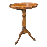 Small wooden pedestal table