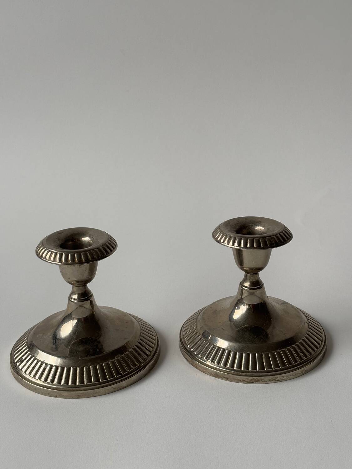 Antique silver-plated metal candlesticks