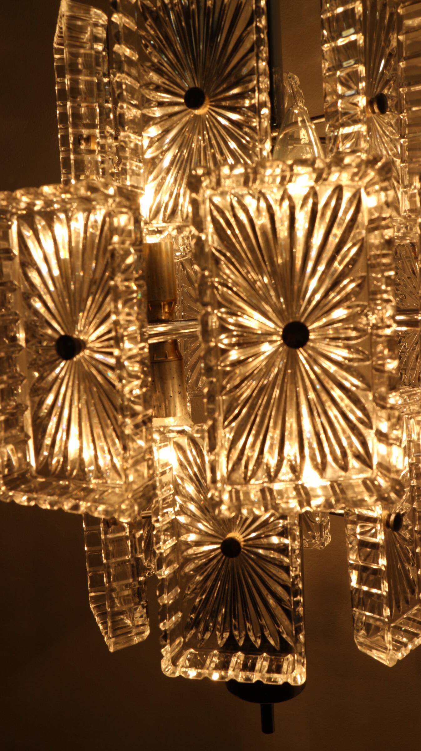 Vintage metal chandelier and carved glass