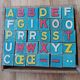Instructional alphabetical cubes from the early 20th century.