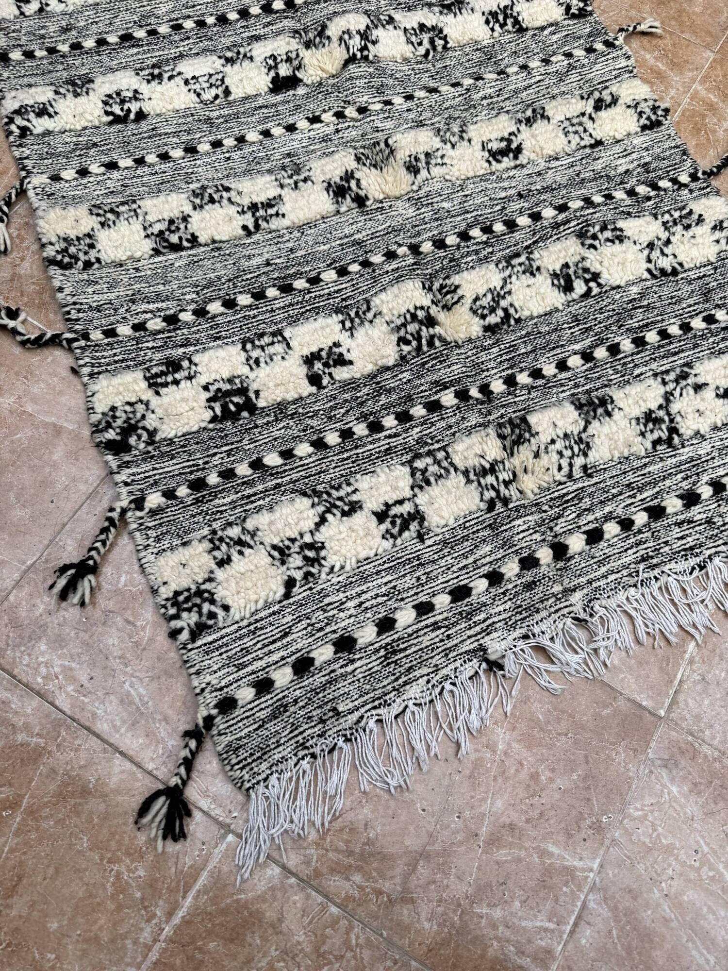 Small black Moroccan Berber Zanafi kilim rug for bedroom and living room.
