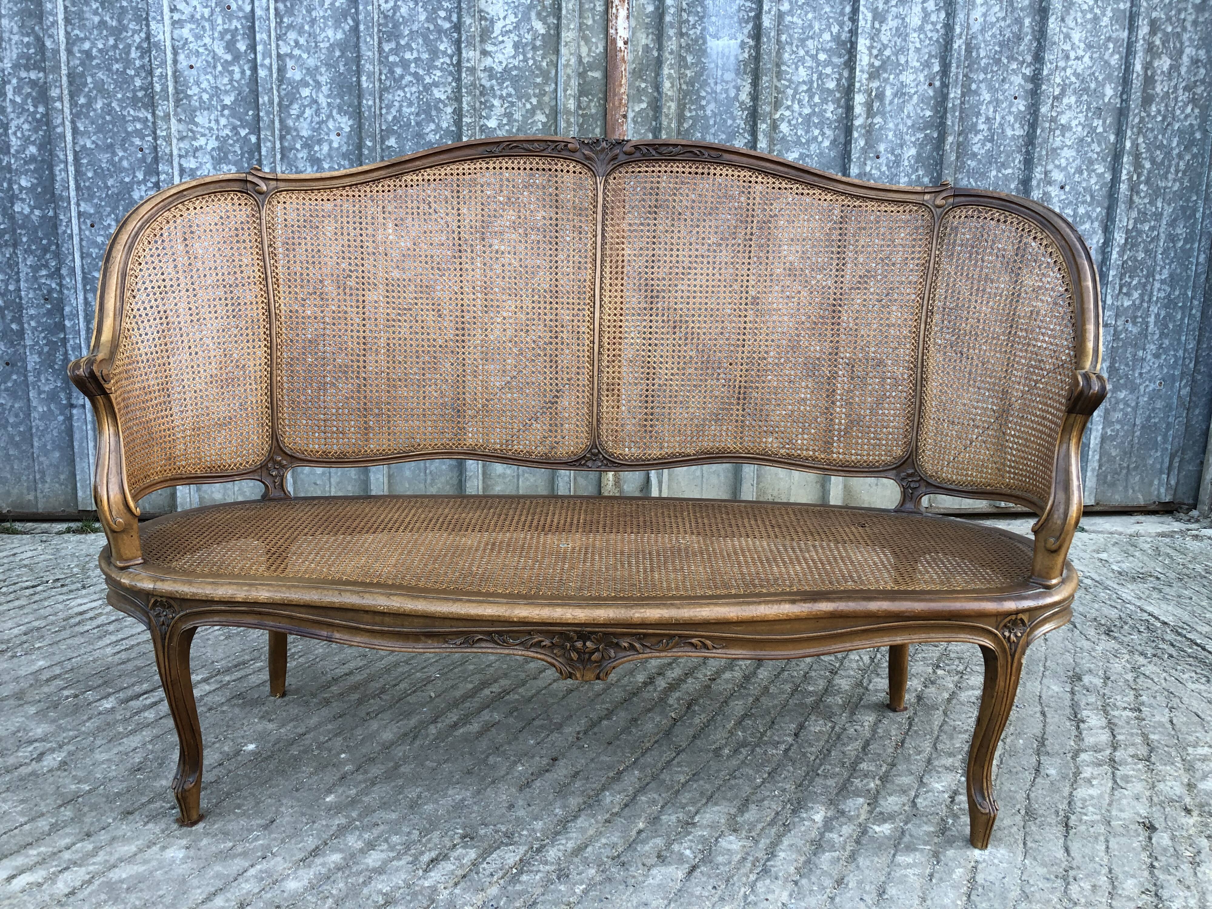 Antique Louis XV bench in solid walnut and caning