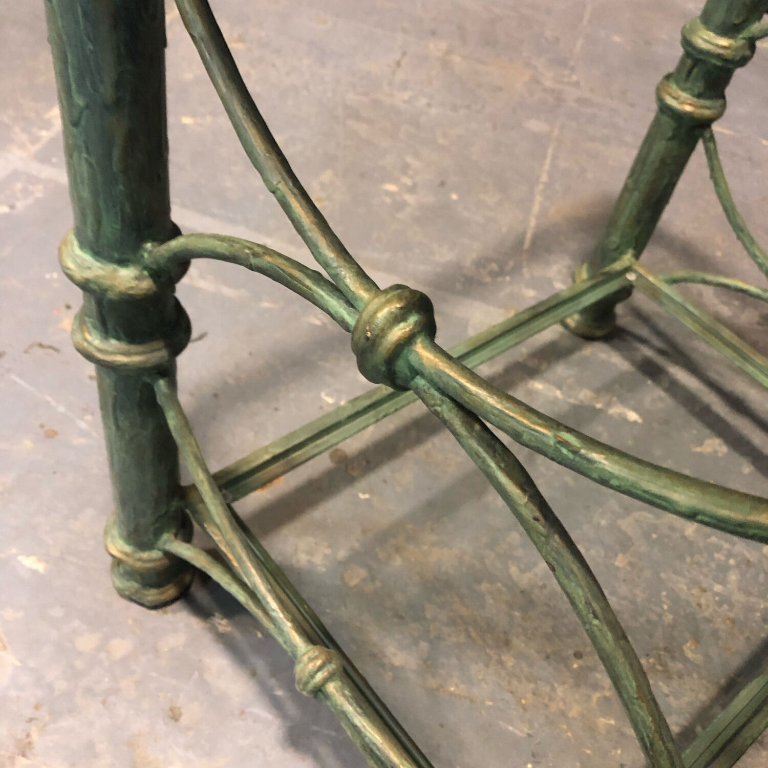 Iron and glass side table with antique patina