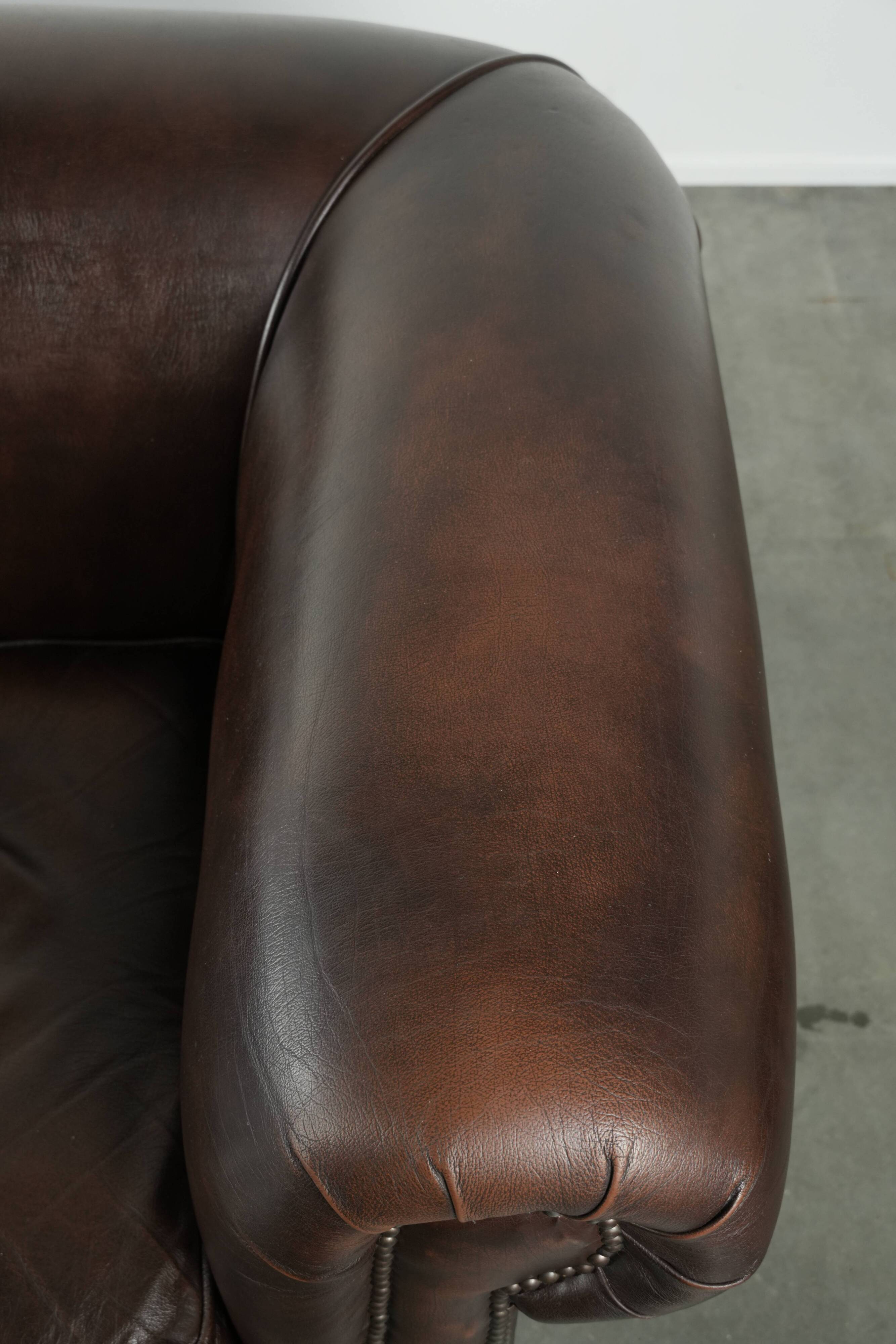 Luxury brown smooth cow leather Chesterfield sofa with an English look