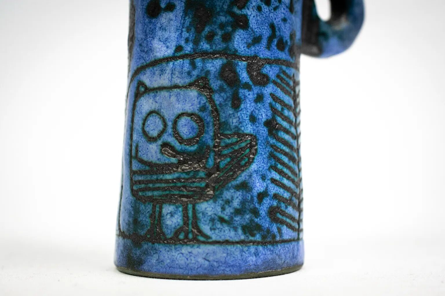 Small jug by Jacques Blin in blue ceramic with engraved animal decoration.