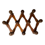 Ancien porte manteau accordéon en bois.