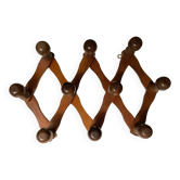 Ancien porte manteau accordéon en bois.