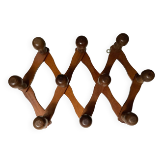 Old wooden accordion coat rack.