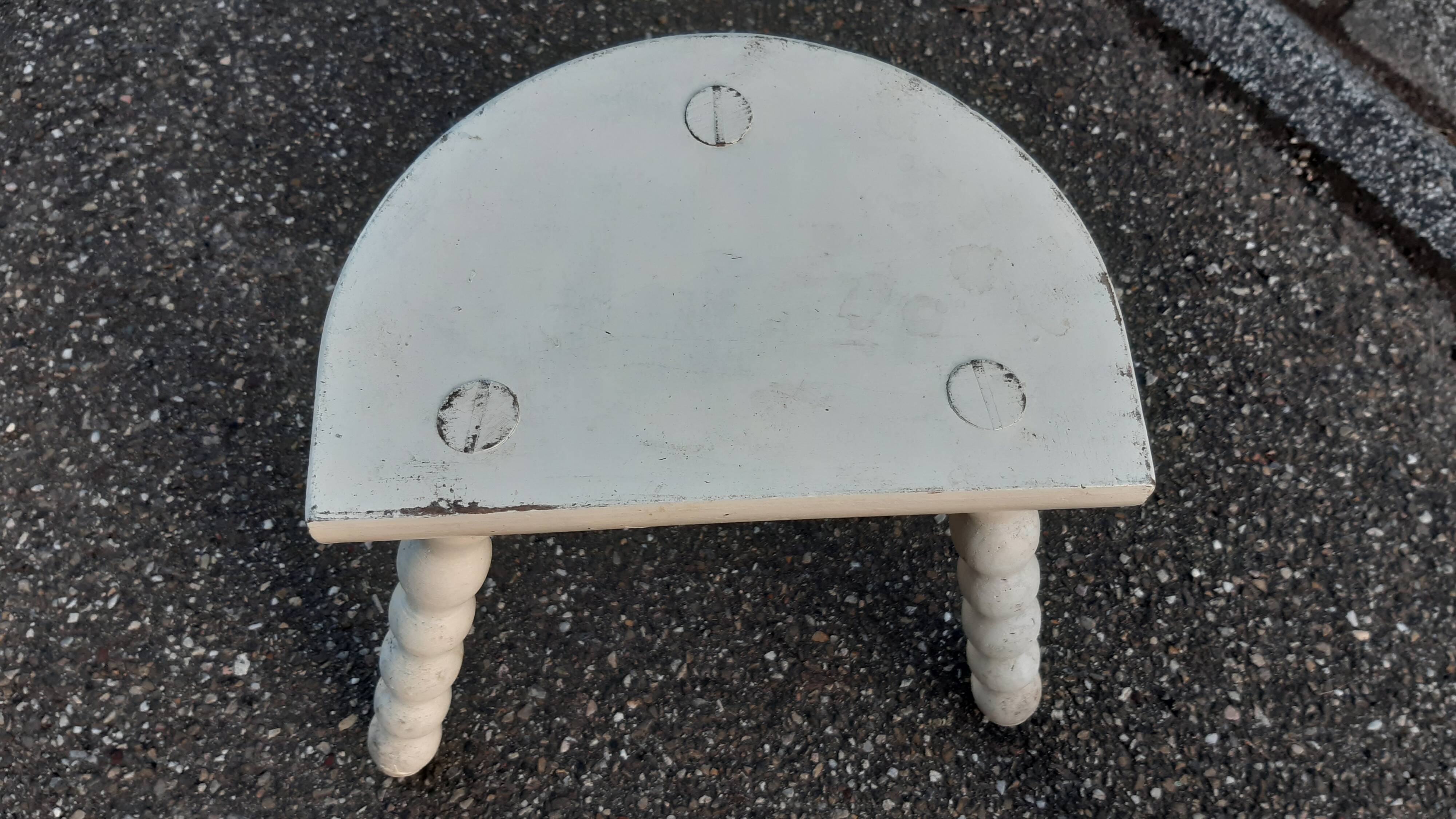 Duo of milking stools with turned legs.