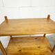 Scandinavian rectangular shelf from the 1960s, made of solid pine with round pencil legs.
