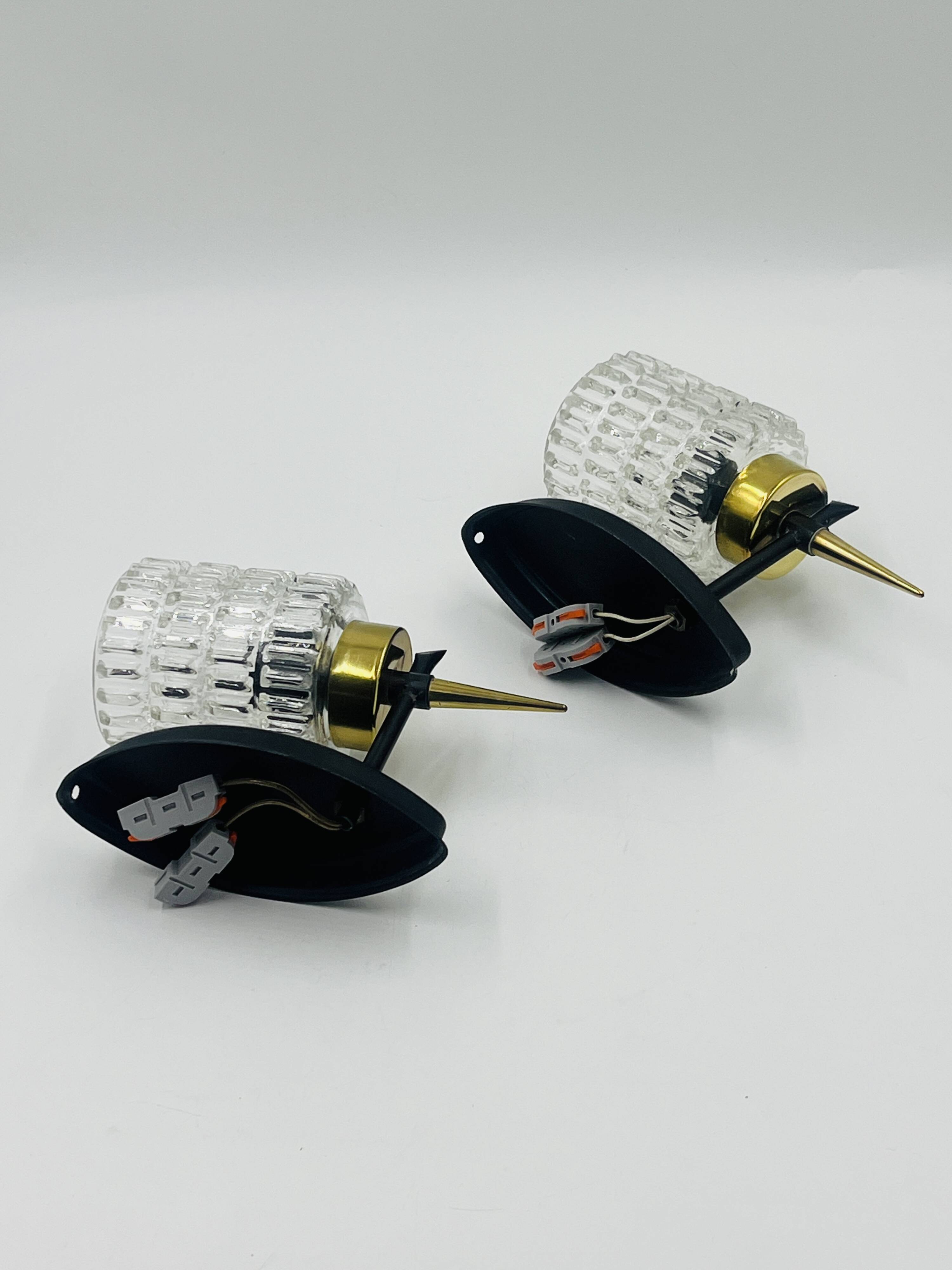 Pair of vintage wall lights with textured glass, attributed to Maison Arlus.