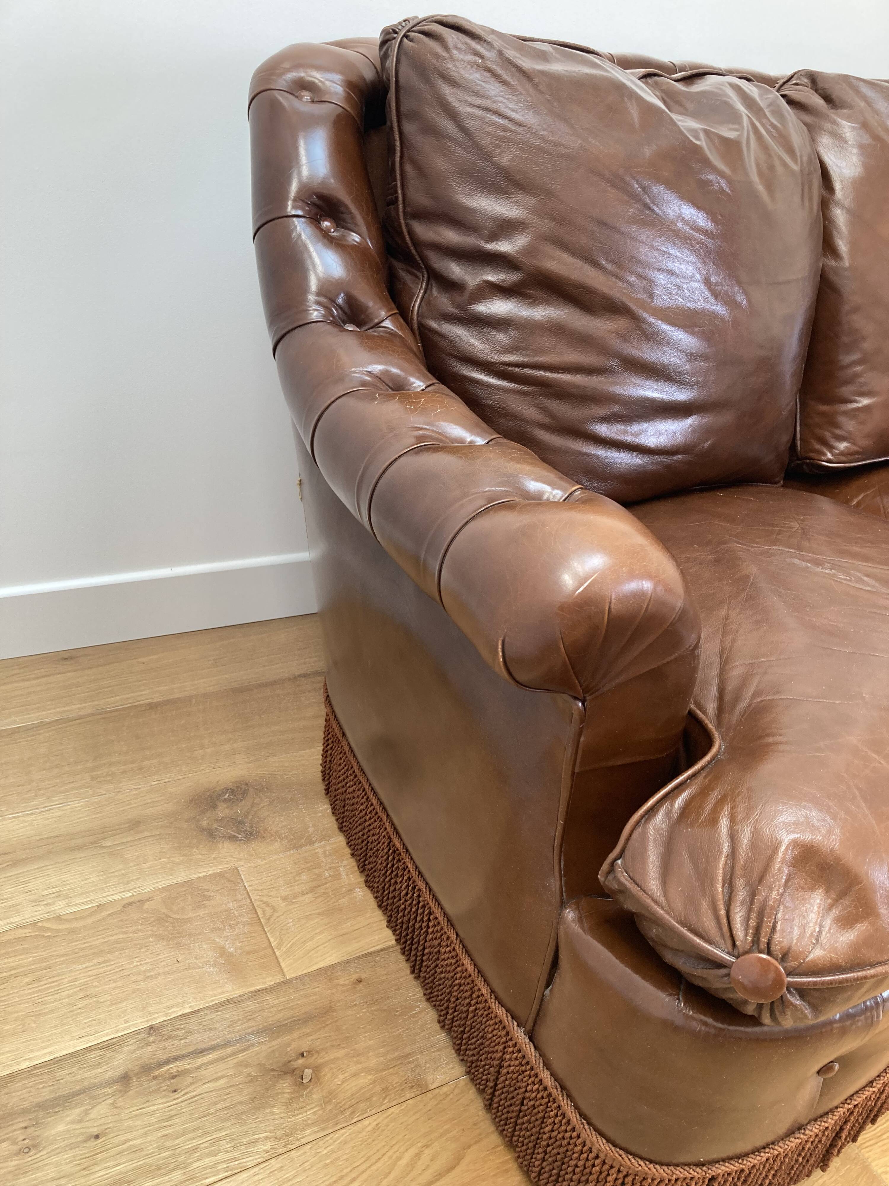 Chesterfield leather sofa with fringes