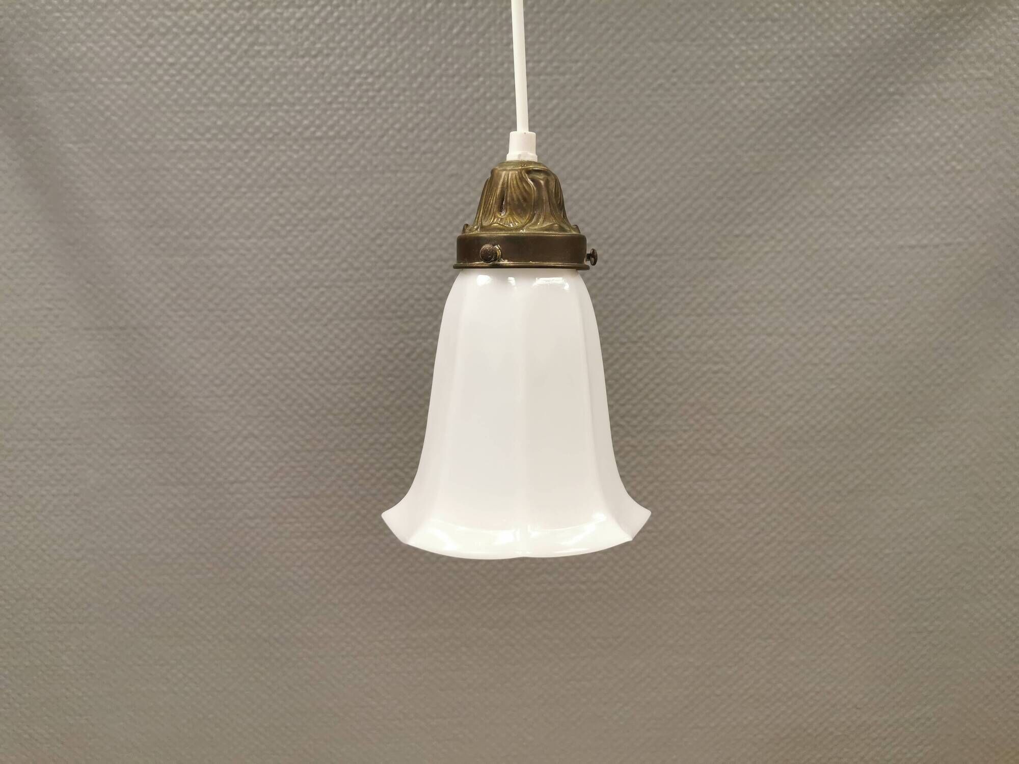 Small delicious tulip shaped hanging lamp in white opal glass with brass top.