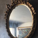 Oval golden mirror