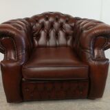 Curved brown leather chesterfield armchair