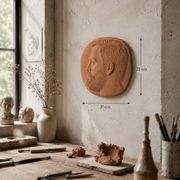 Bas-relief mural in terracotta, profile of a man, signed, 21 x 20 cm, 1984.