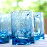 Four Biot glass mugs blue bubbled glass