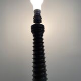 Turned wooden lamp foot in the shape of a warhead