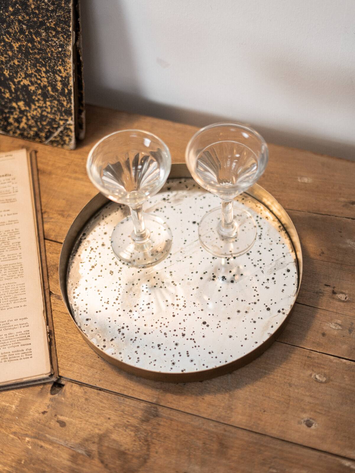 Patinated mirrored top and brass