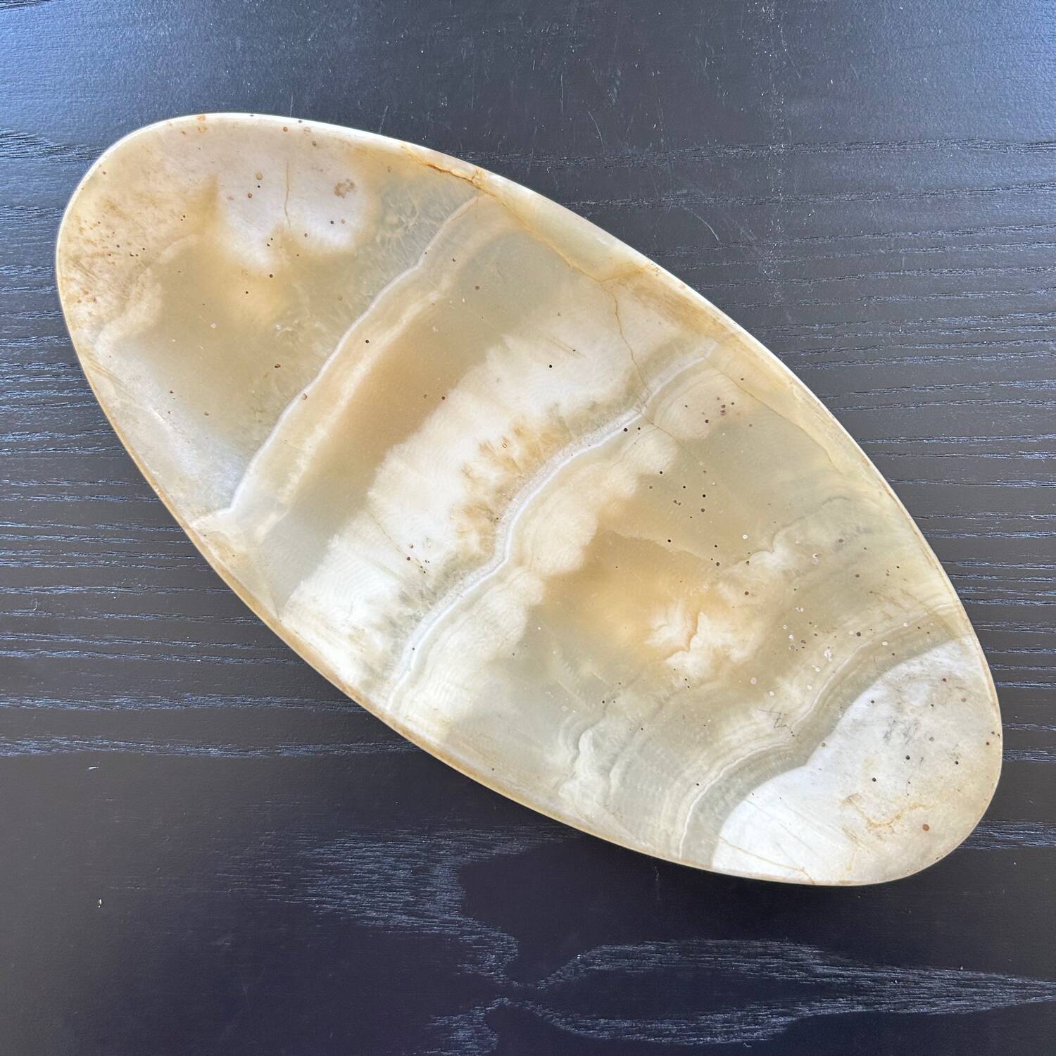 Oval onyx pocket emptier