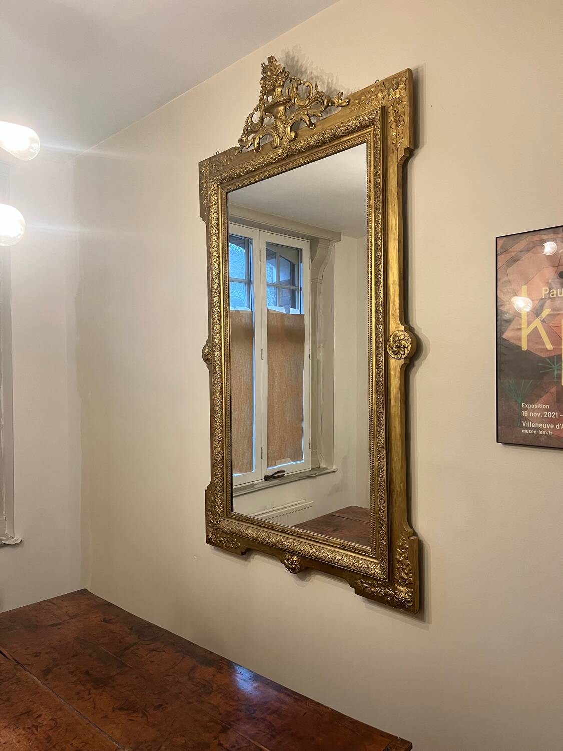 Antique Louis XVI style mirror in gilded wood