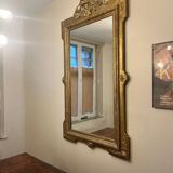 Antique Louis XVI style mirror in gilded wood