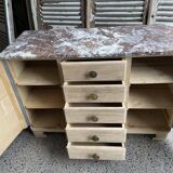 Raw wood chest of drawers with marble top
