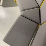 Yellow tubular modular bench & gray fabric