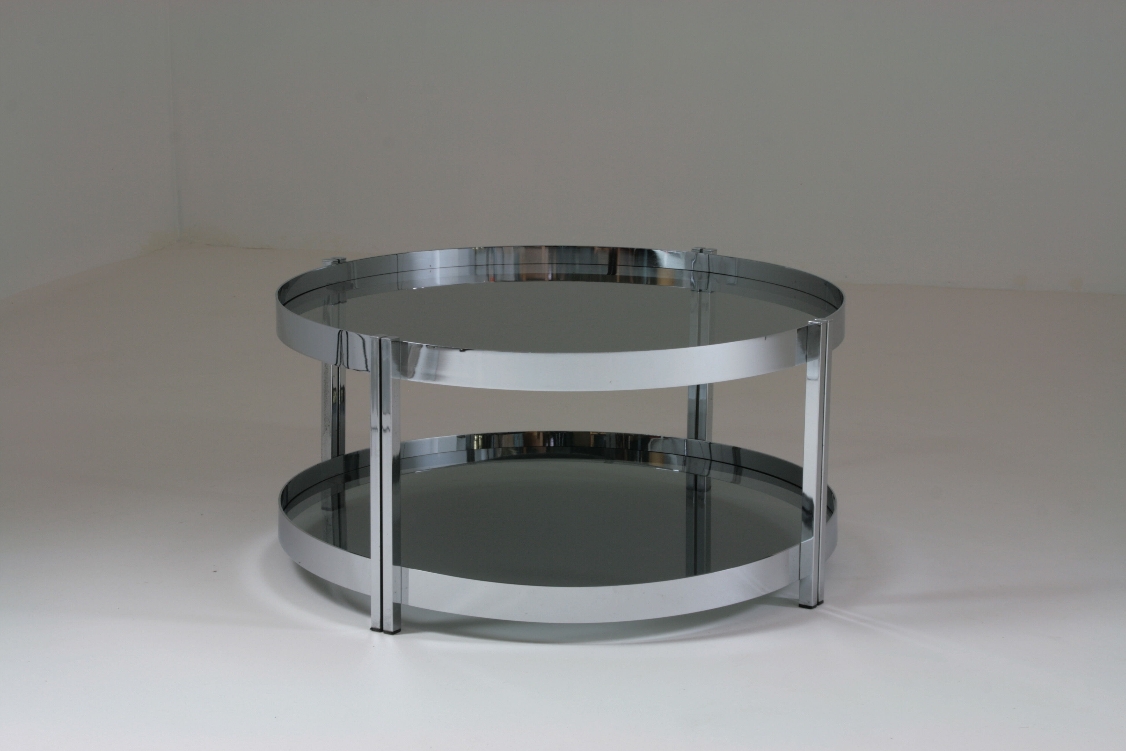 Round chrome-plated metal coffee table and smoked glass tops, France 1970s