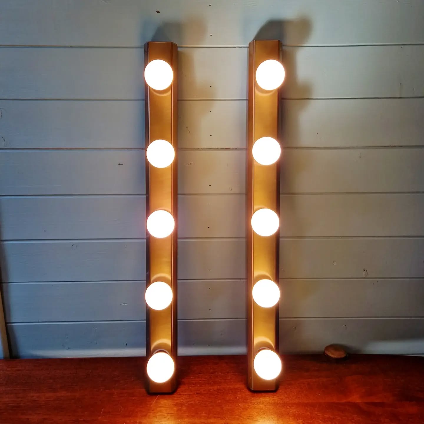 Set of three wall sconces in solid brass, 1970s-80s.
