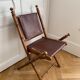 Lot de trois chaises d’officier pliantes bois et cuir