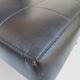 Modernist armchair in black faux leather and metal – 1960s