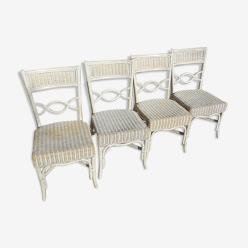 4 white rattan chairs