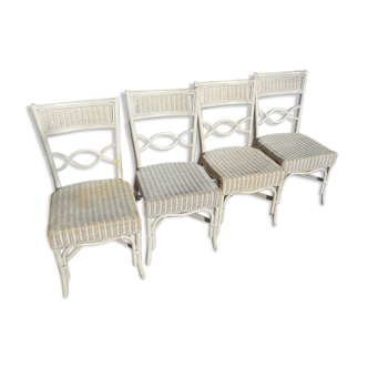 4 white rattan chairs