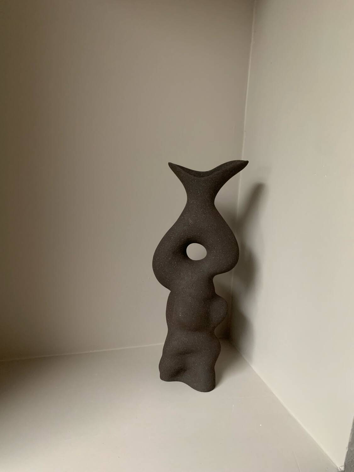 Black stoneware vase in an organic shape