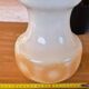 2 vintage pendant lights in white opaline with orange patterns and chrome.