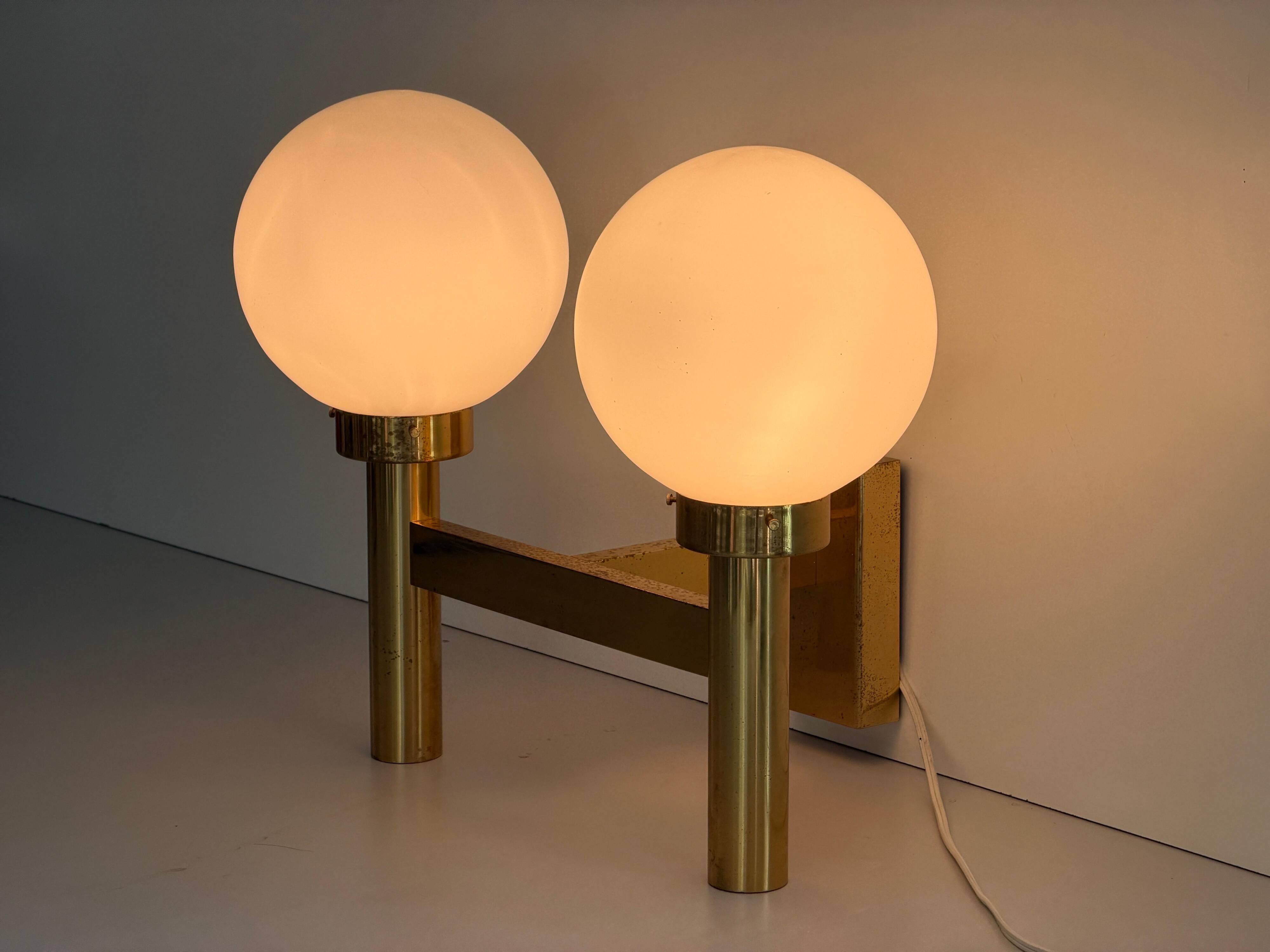 Double opal glass and heavy brass, large minimalist cinema wall light, 1960s, Germany