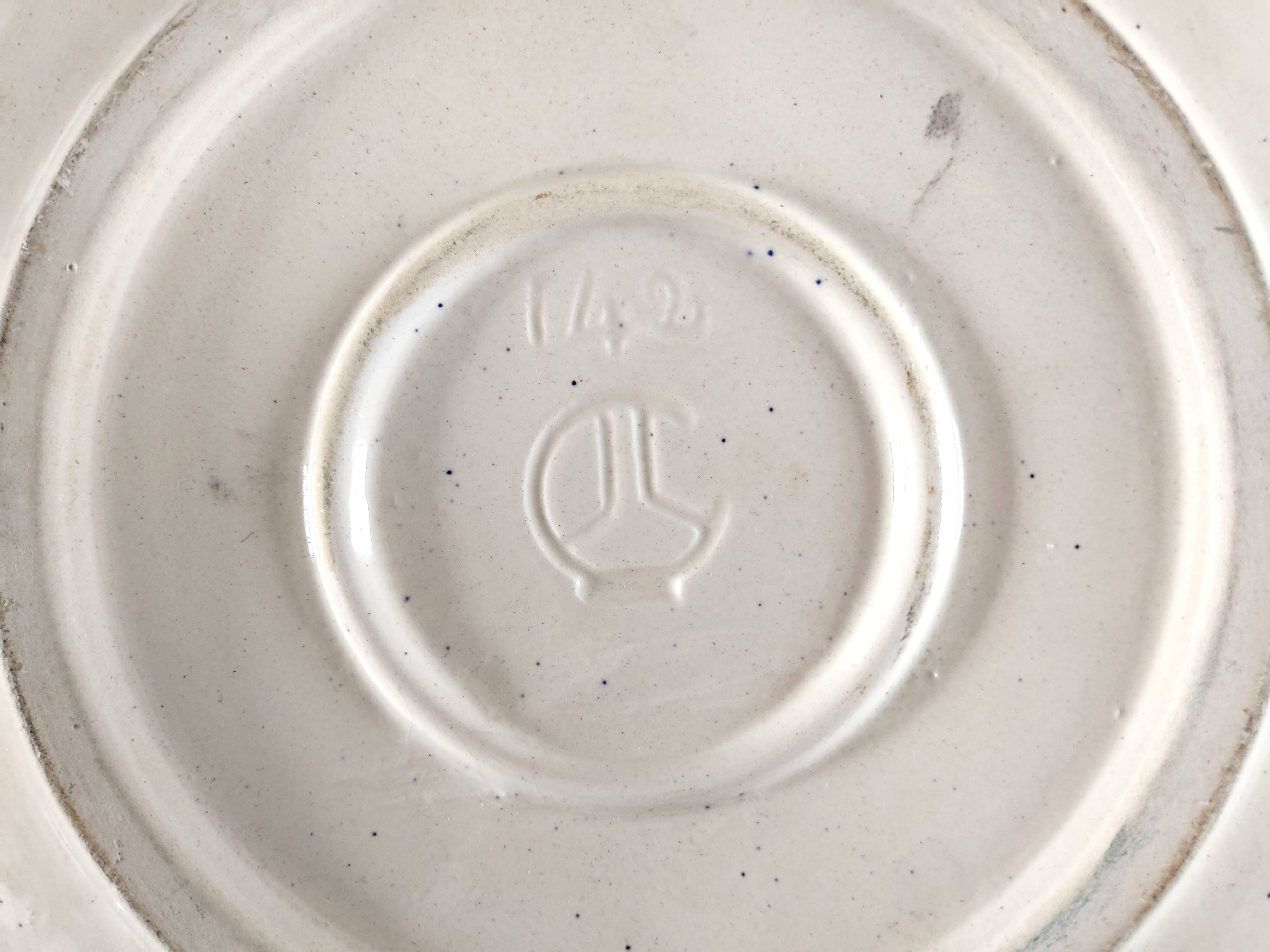 Large decorative dish with colorful peacock