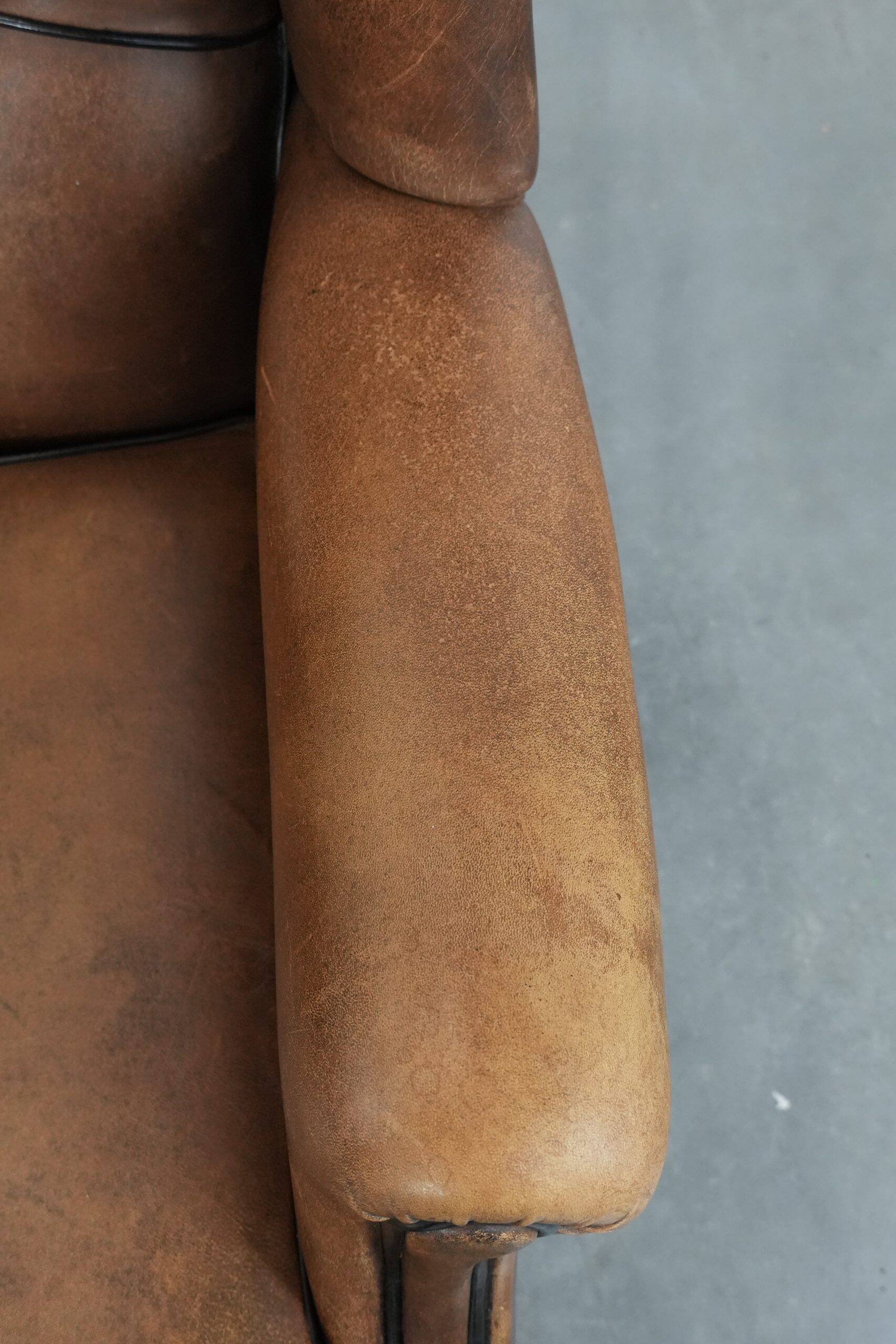 Sheepskin wingback armchair with beautiful colours in good condition