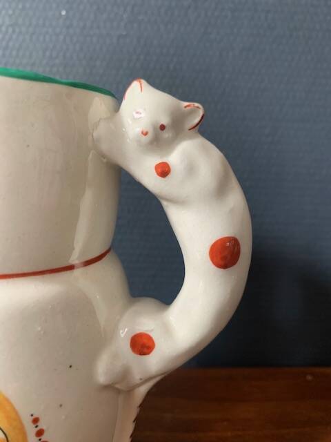 Hand-painted earthenware cream pot with cat handle, 19th century