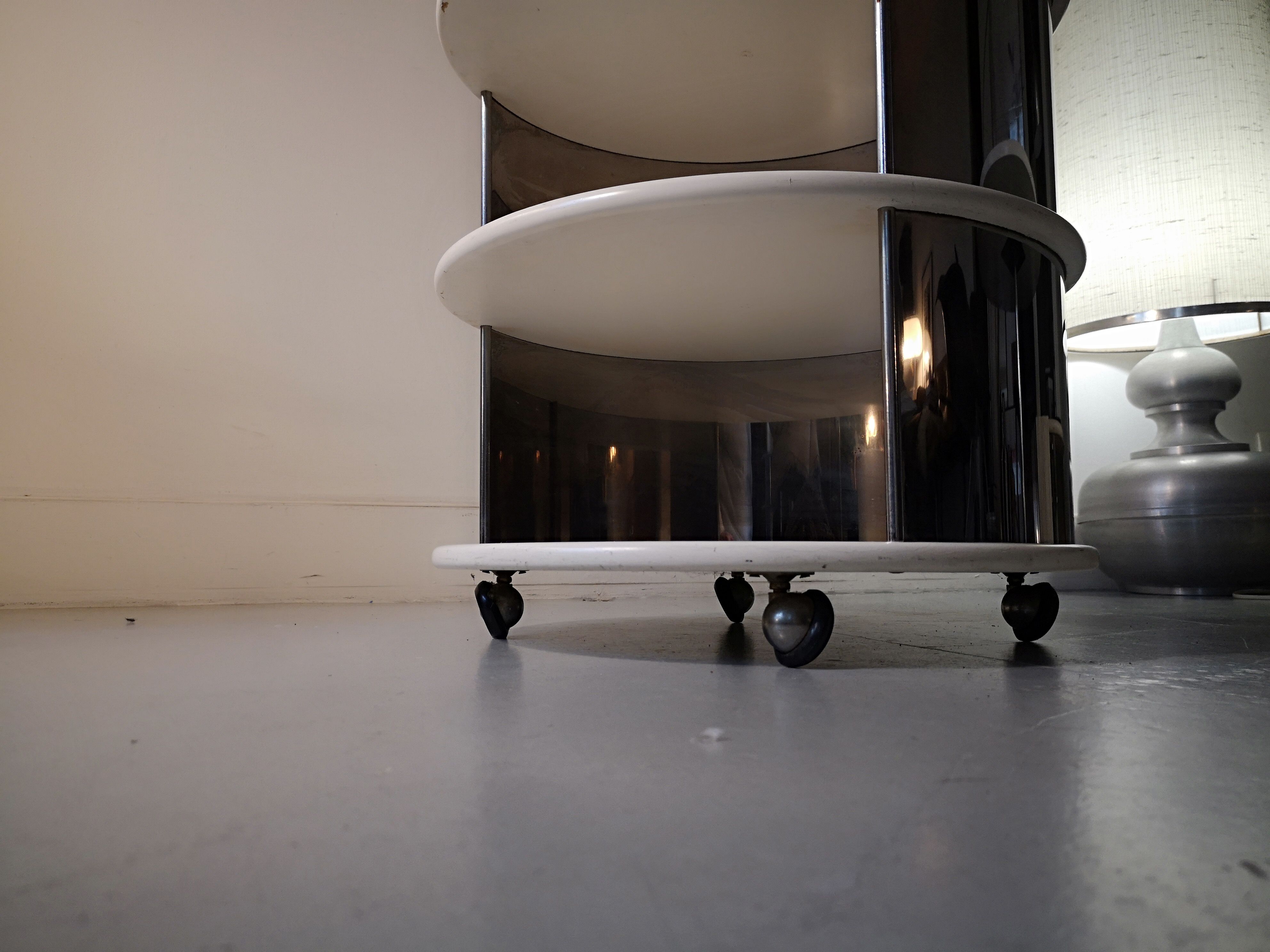 Pair of mirrored space age cylindrical bedside tables, 1960
