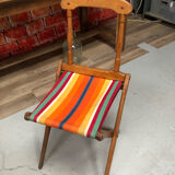 Old vintage camping chair wood and canvas