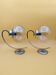 Pair of chrome metal wall lights with glass globe
