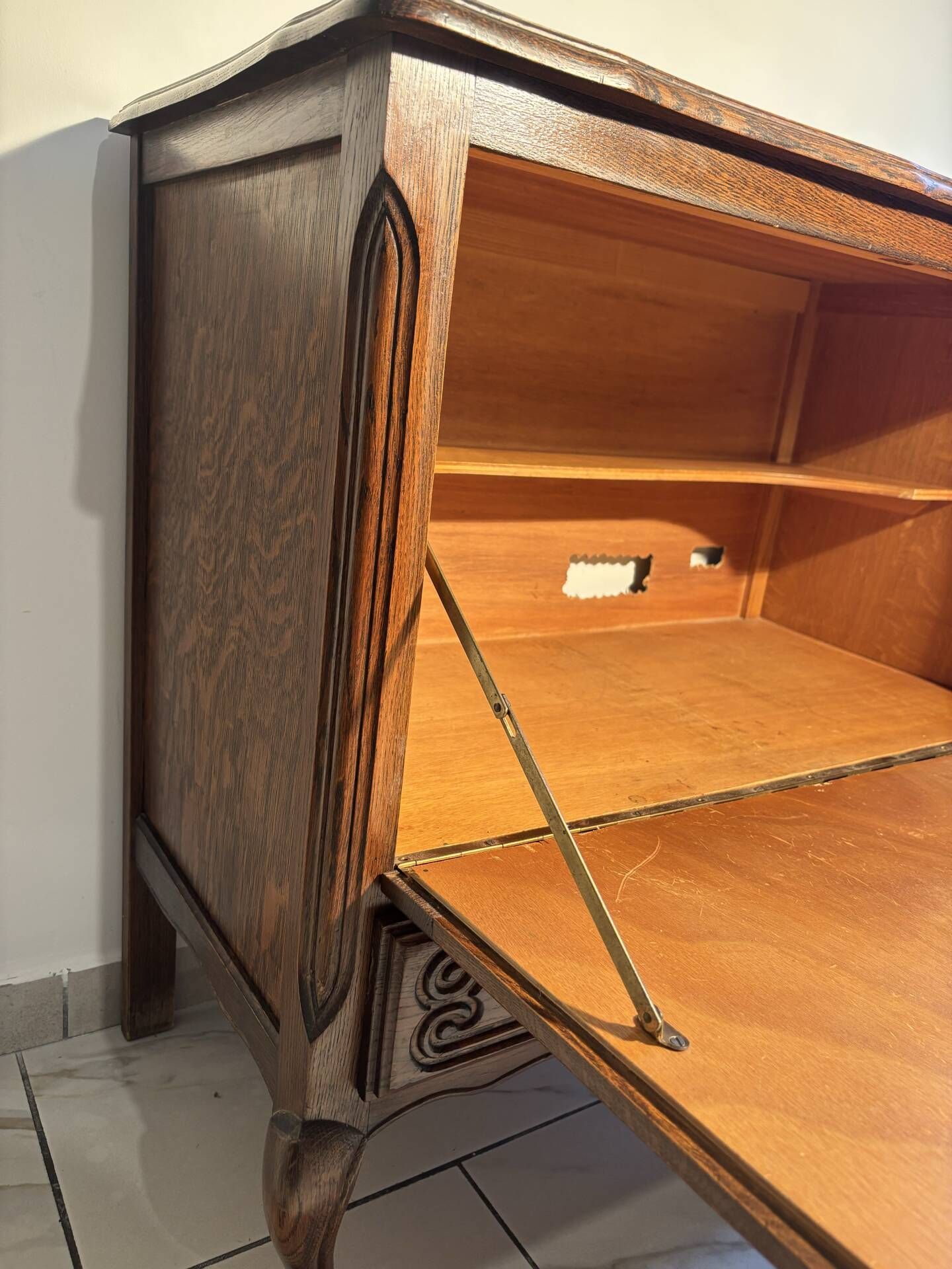 Louis XV style oak TV cabinet with drop-down flap.