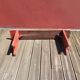 Banc ancien en bois peint en rouge