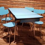 Blue formica table and its 4 chairs