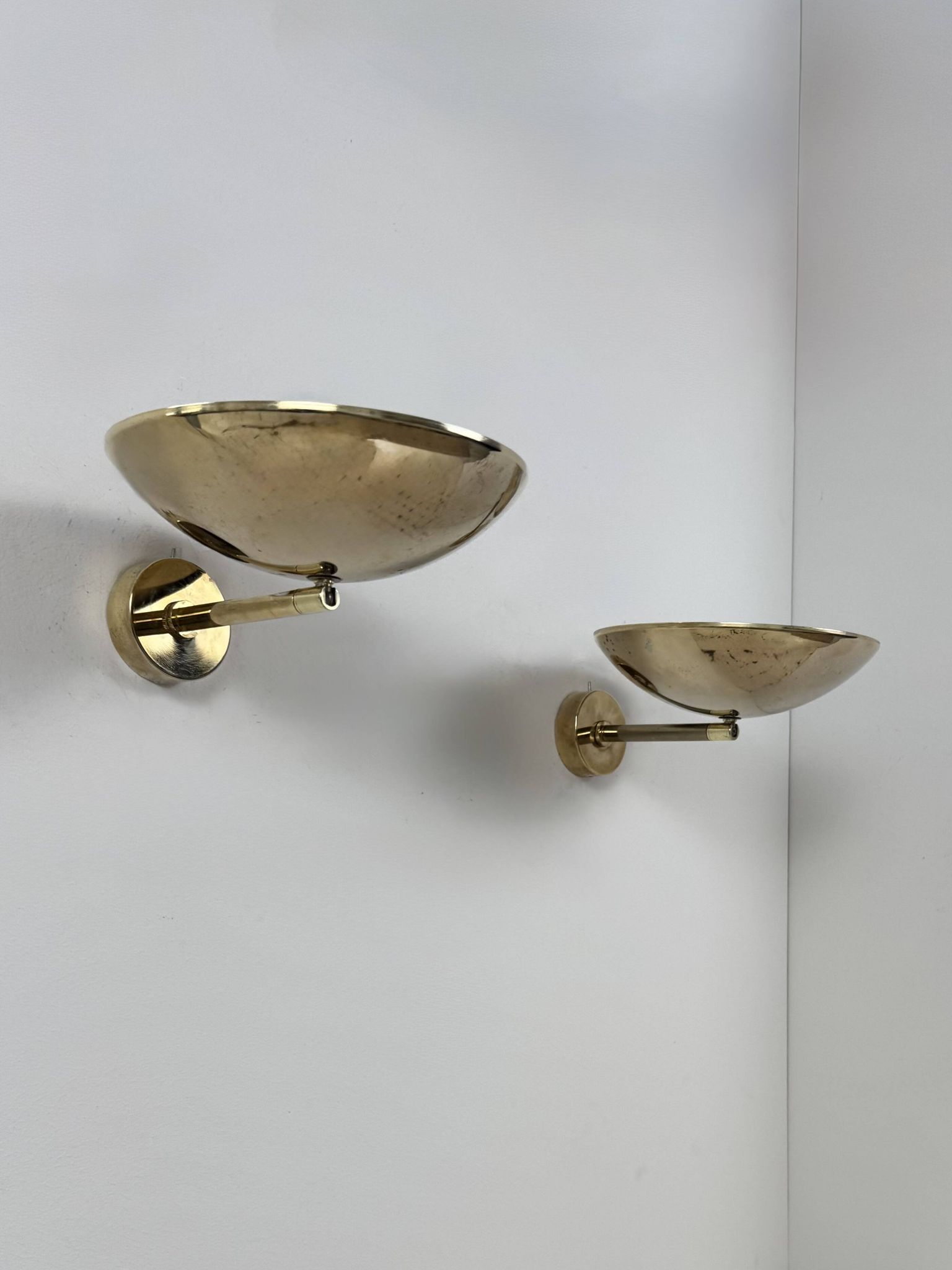 Pair of adjustable vintage wall lights, patinated brass, France, 1970.